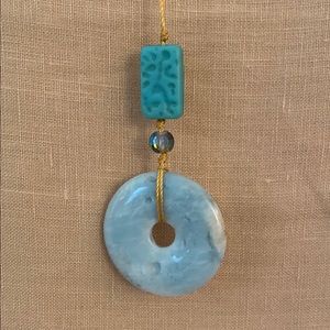 Long Turquoise and gold necklace.